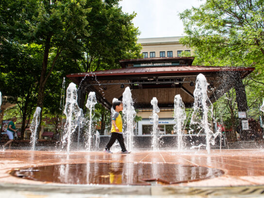 photo of child playing in water at Rockville Town Center