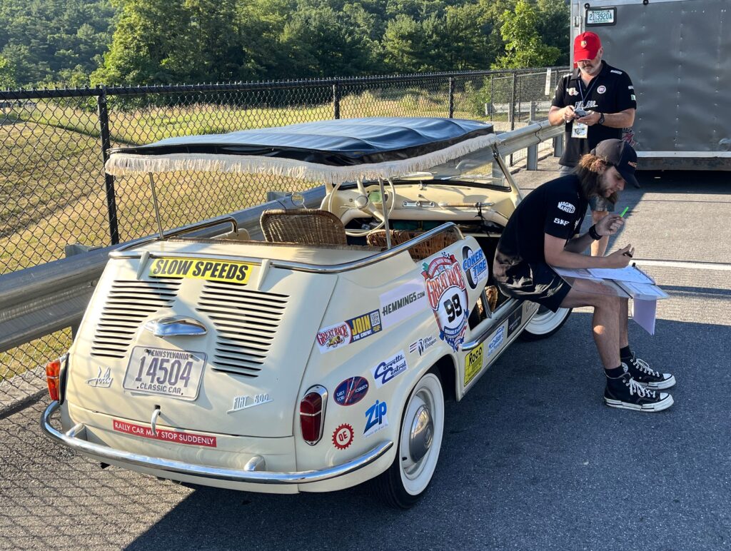 photo of the Great Race Race crew studying instructions